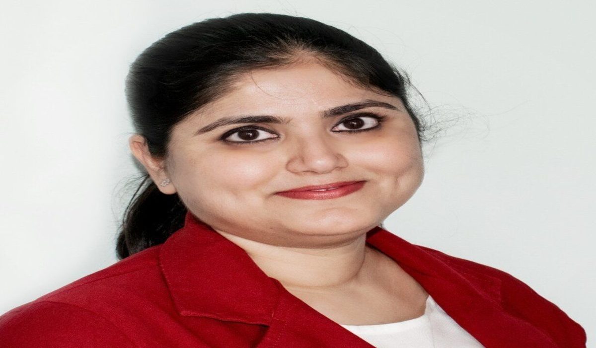 Dr. Neha Nakra — clinical psychologist in a red blazer, photographed for her Apollo Hospitals profile